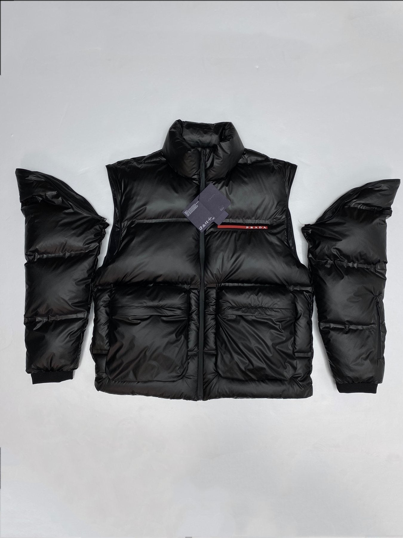 Prada Black Convertible Puffer Jacket with Red Chest Stripe — context