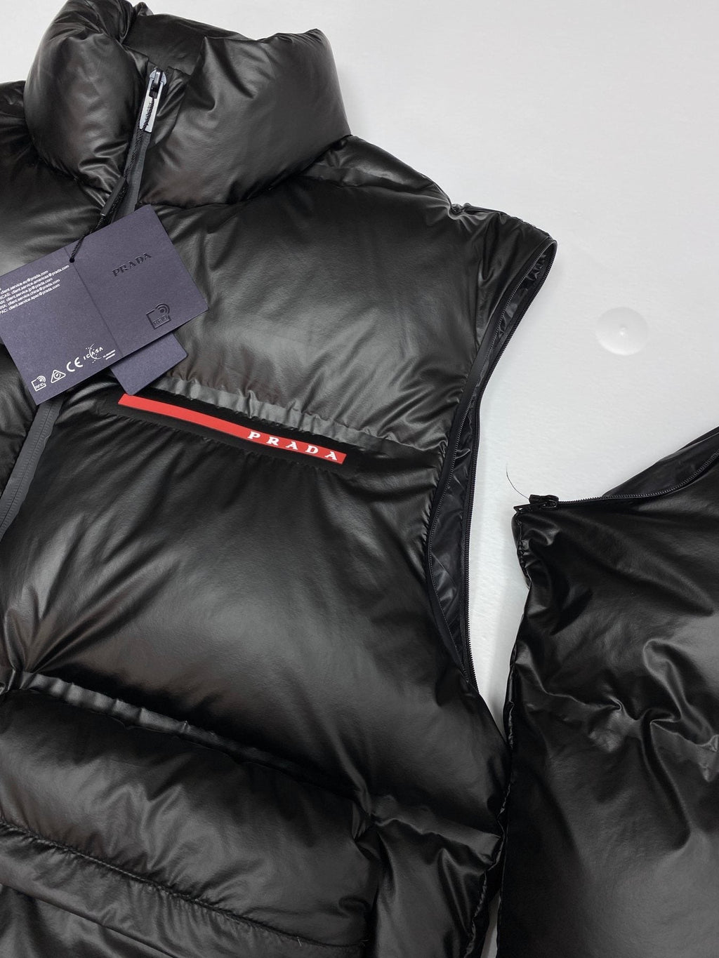Prada Black Convertible Puffer Jacket with Red Chest Stripe — context