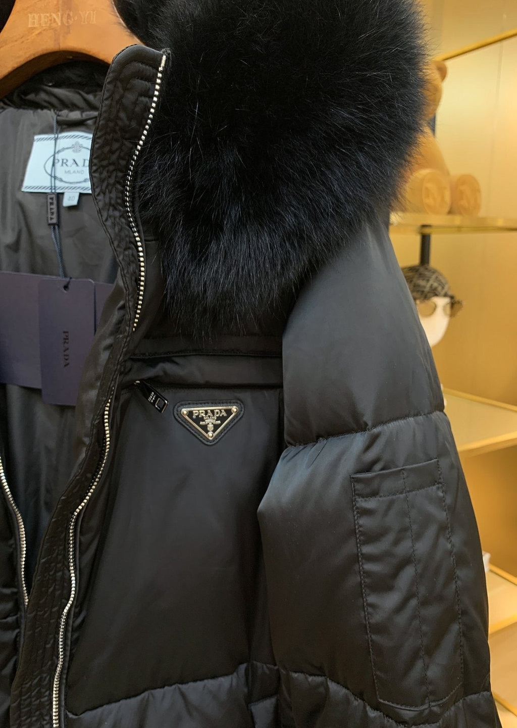 Prada Long Belted Puffer Jacket — detail