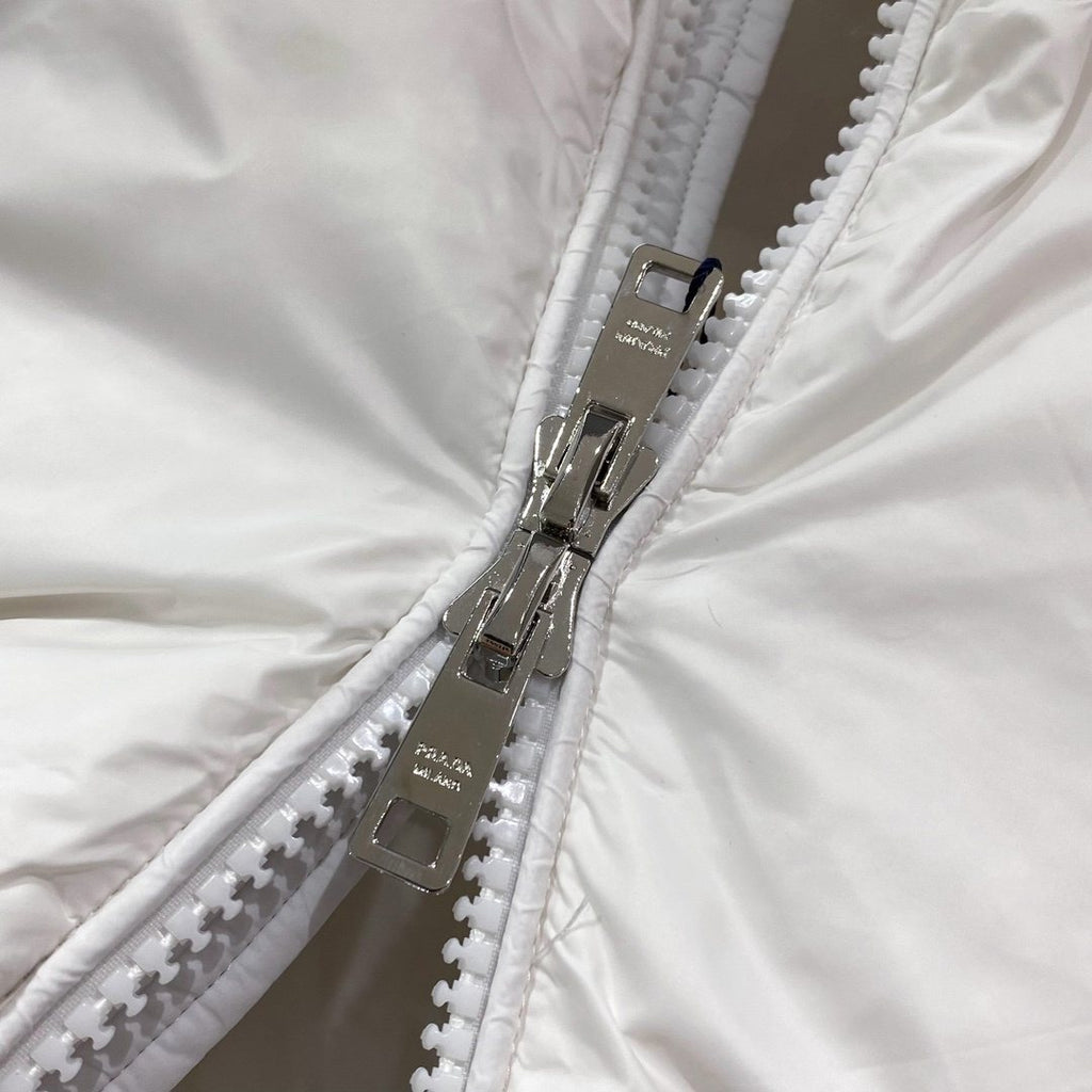 Prada Quilted Triangle Badge Puffer Jacket — detail