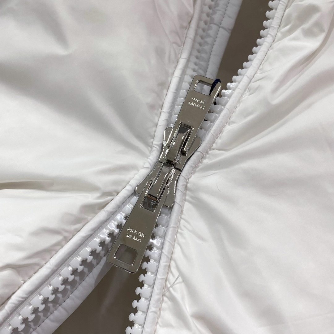 Prada Quilted Triangle Badge Puffer Jacket — detail