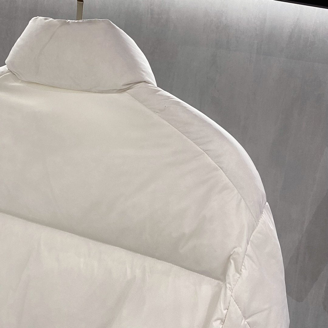 Prada Quilted Triangle Badge Puffer Jacket — detail
