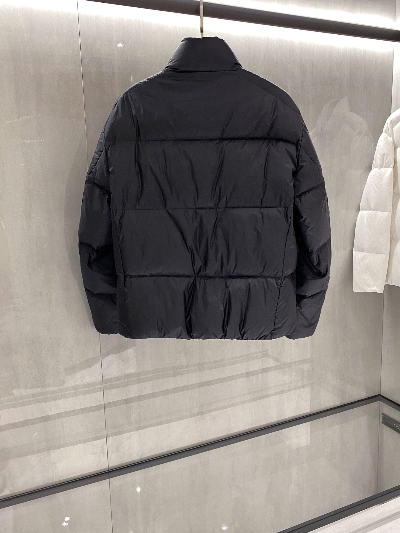 Prada Quilted Triangle Badge Puffer Jacket — back