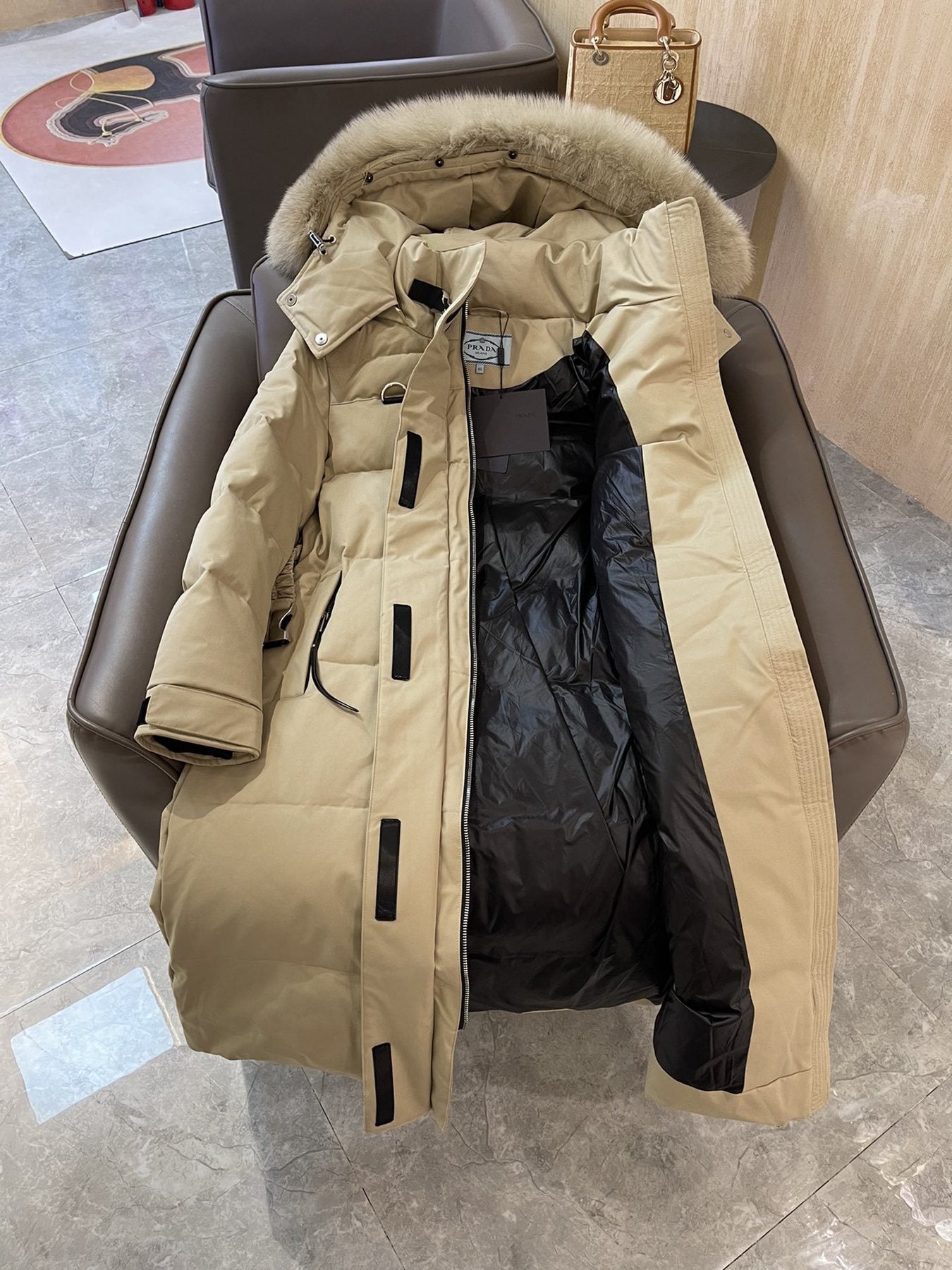 Prada Fur-Trim Belted Long Down Jacket — hang_tag