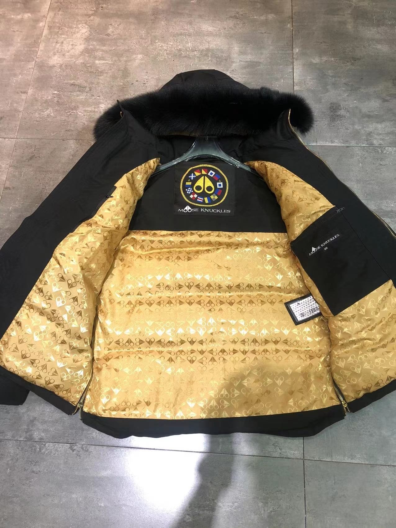 Moose Knuckles Black Hooded Puffer Jacket with Gold Lining — detail
