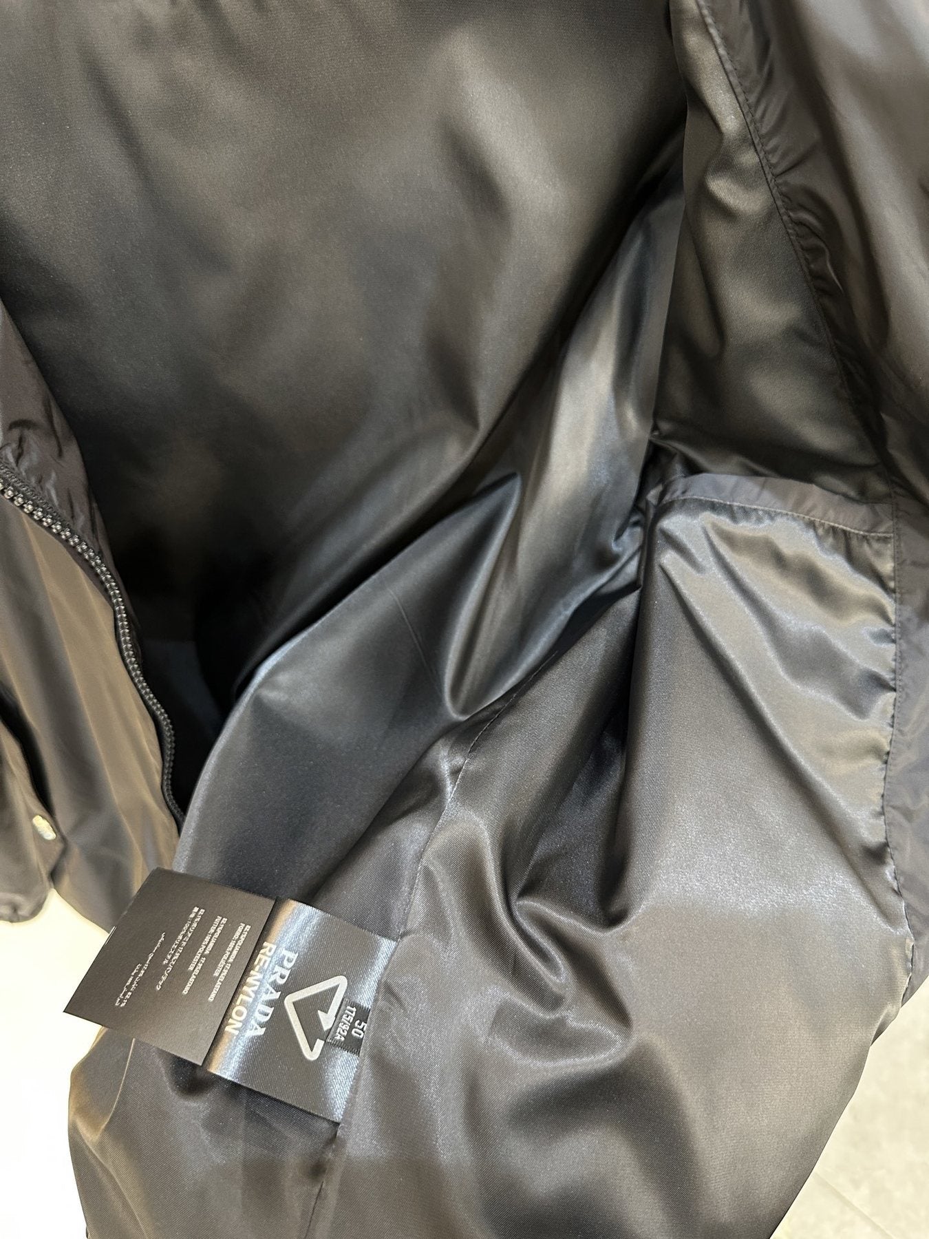 Prada Stand-Collar Zip Jacket — hang_tag
