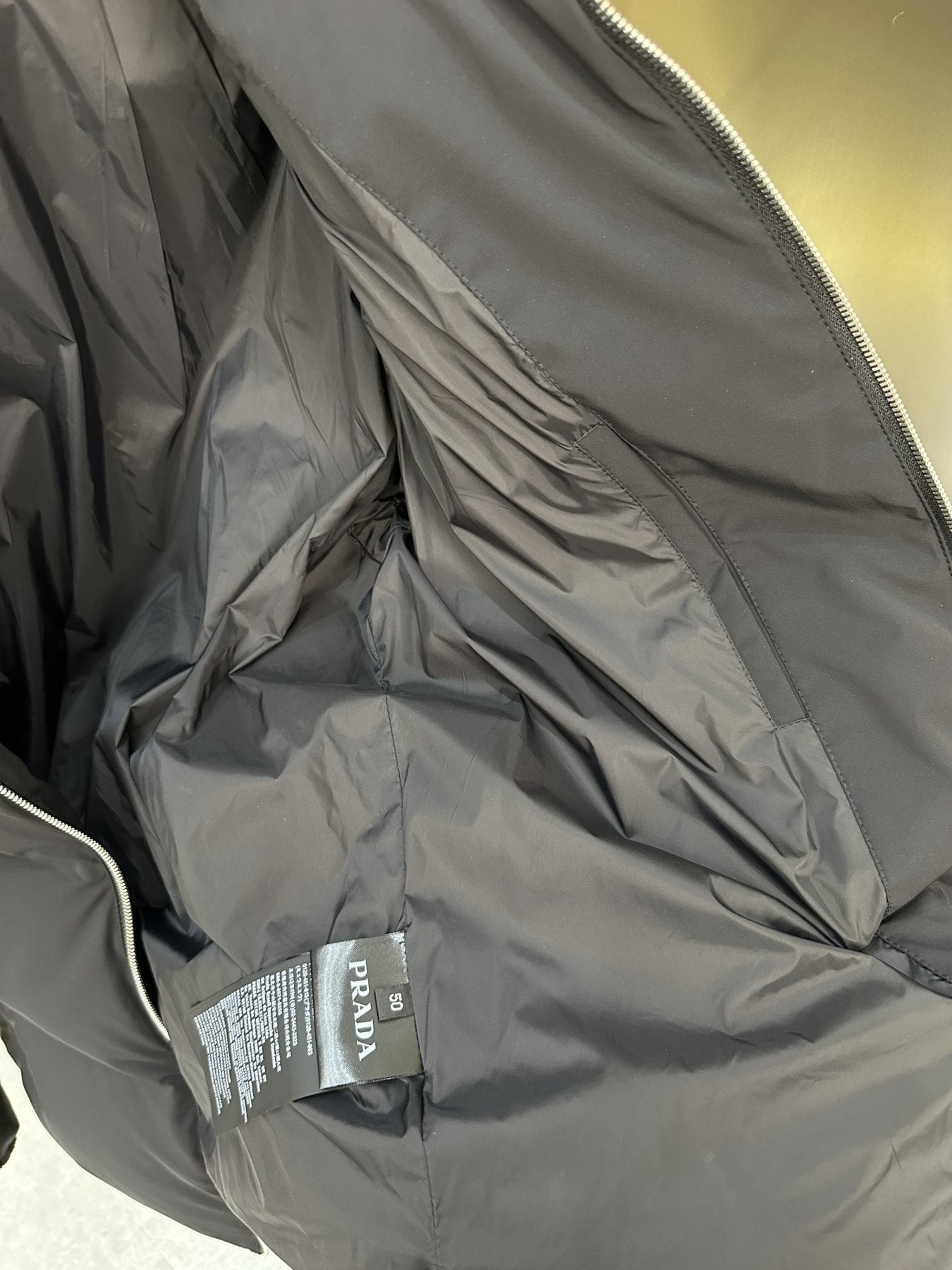 Prada Quilted Triangle-Badge Puffer Jacket — neck_label