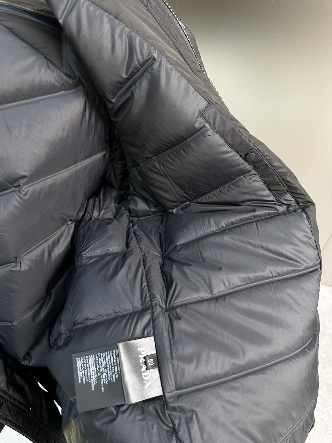 Prada Black Hooded Quilted Puffer Jacket — hang_tag