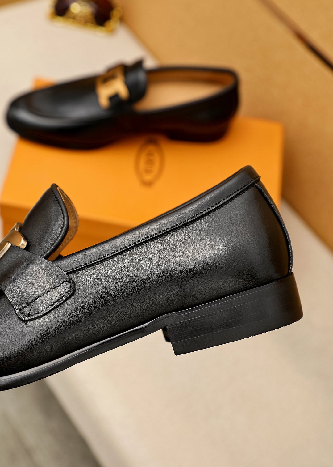 Tod's Black Gold-Hardware Loafers — side