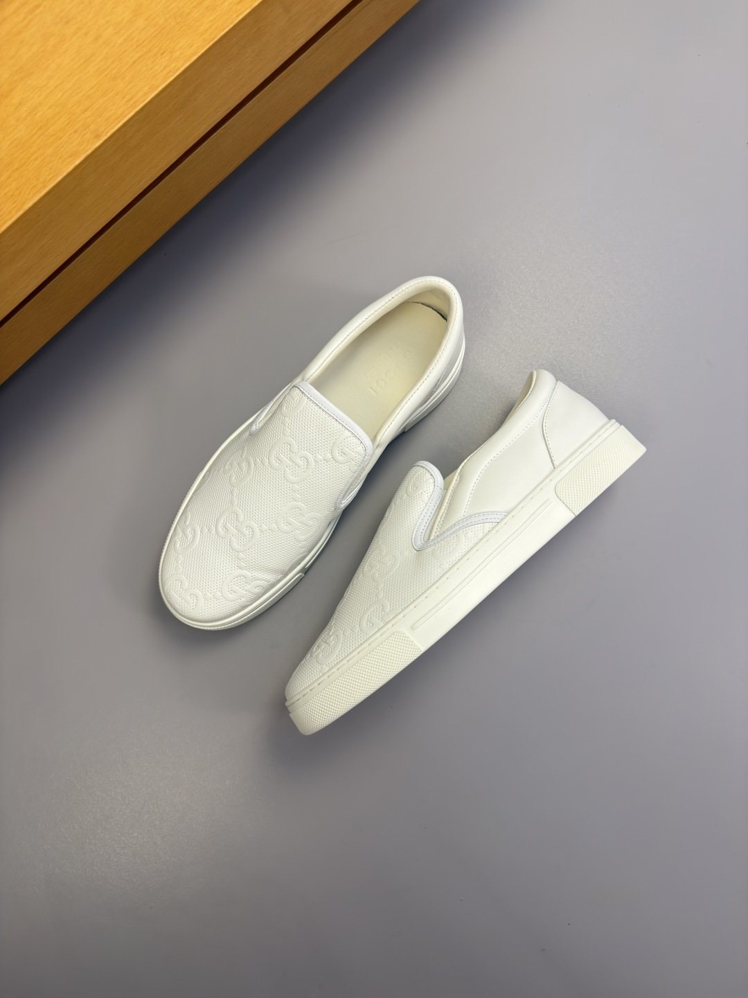 Ivory White Embossed Slip-On Sneakers — front