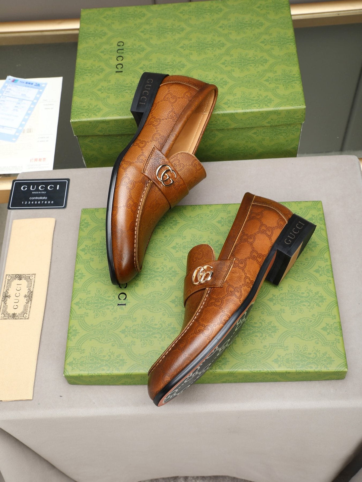 Gucci Brown Monogram Hardware Loafers — front