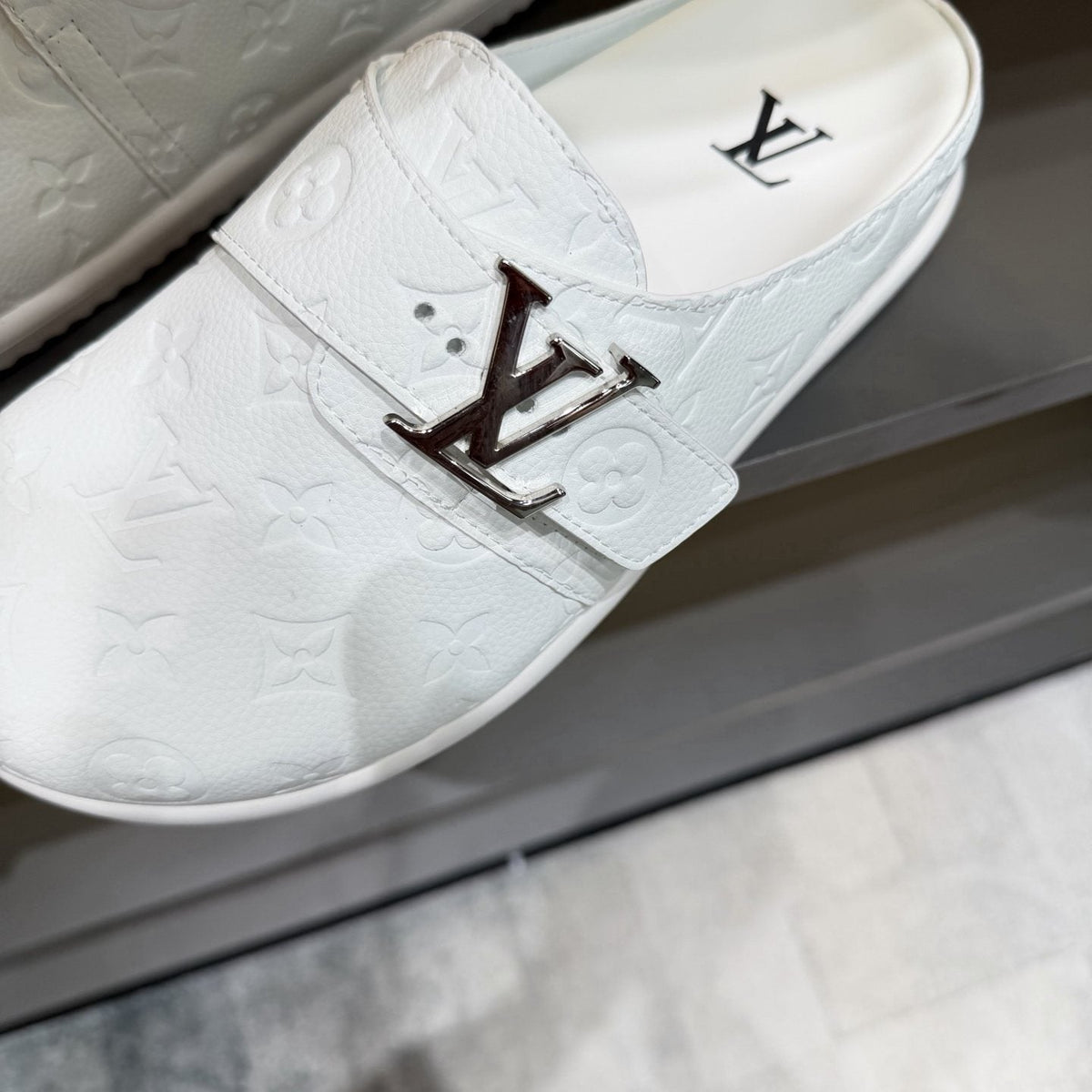 Louis Vuitton White Embossed Slide Sandals — detail