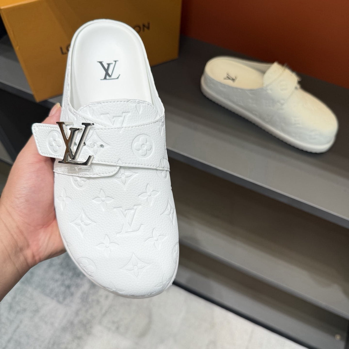 Louis Vuitton White Embossed Slide Sandals — detail