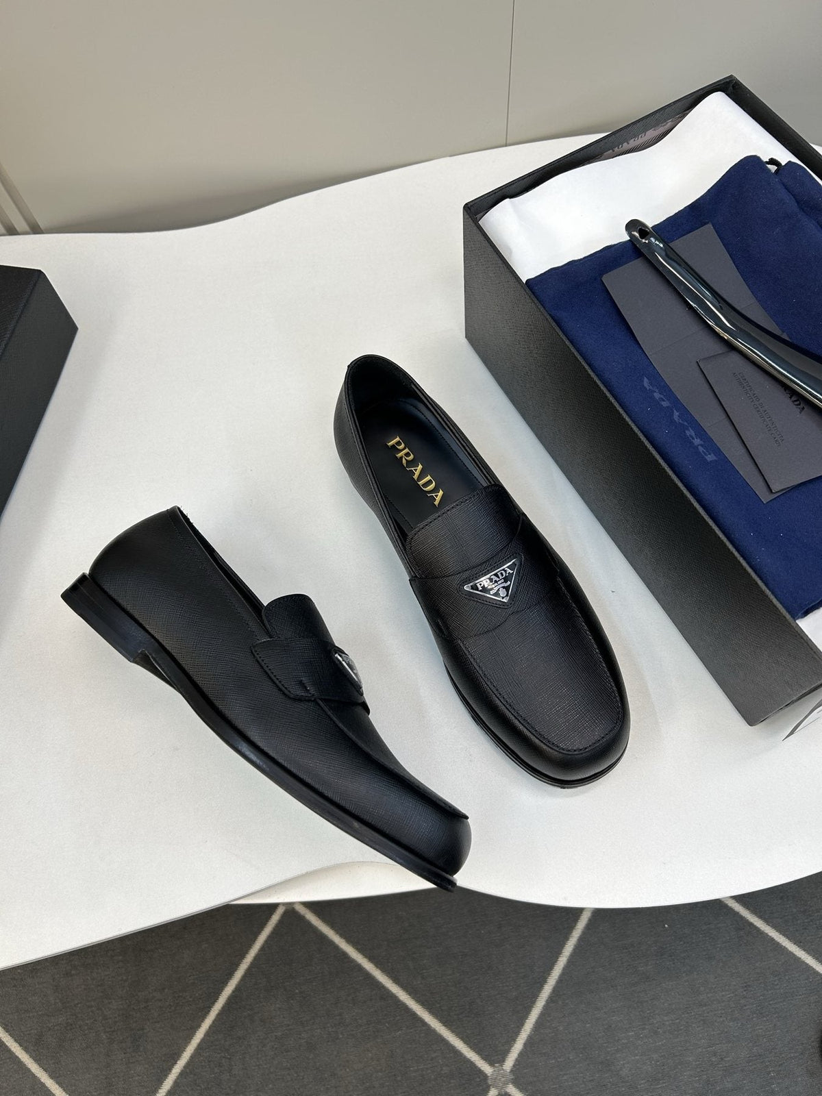 Prada Black Triangular Plaque Loafers — front