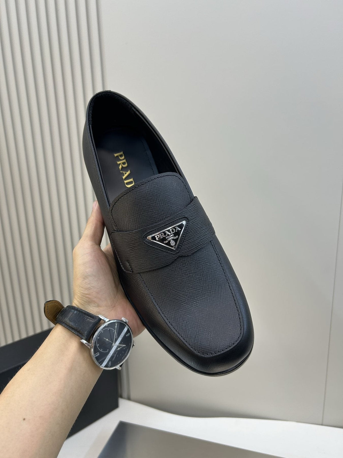 Prada Black Triangular Plaque Loafers — model