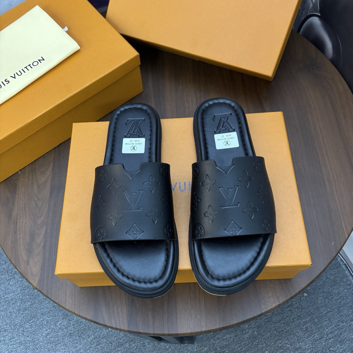 Louis Vuitton Black Embossed Slide Sandals — hero