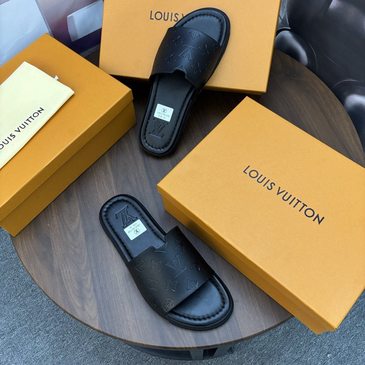 Louis Vuitton Black Embossed Slide Sandals — side