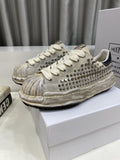 Maison Mihara Yasuhiro Distressed Studded Low-Top Sneakers — hero
