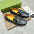 GUCCI Black Metal-Detail Loafers — hero
