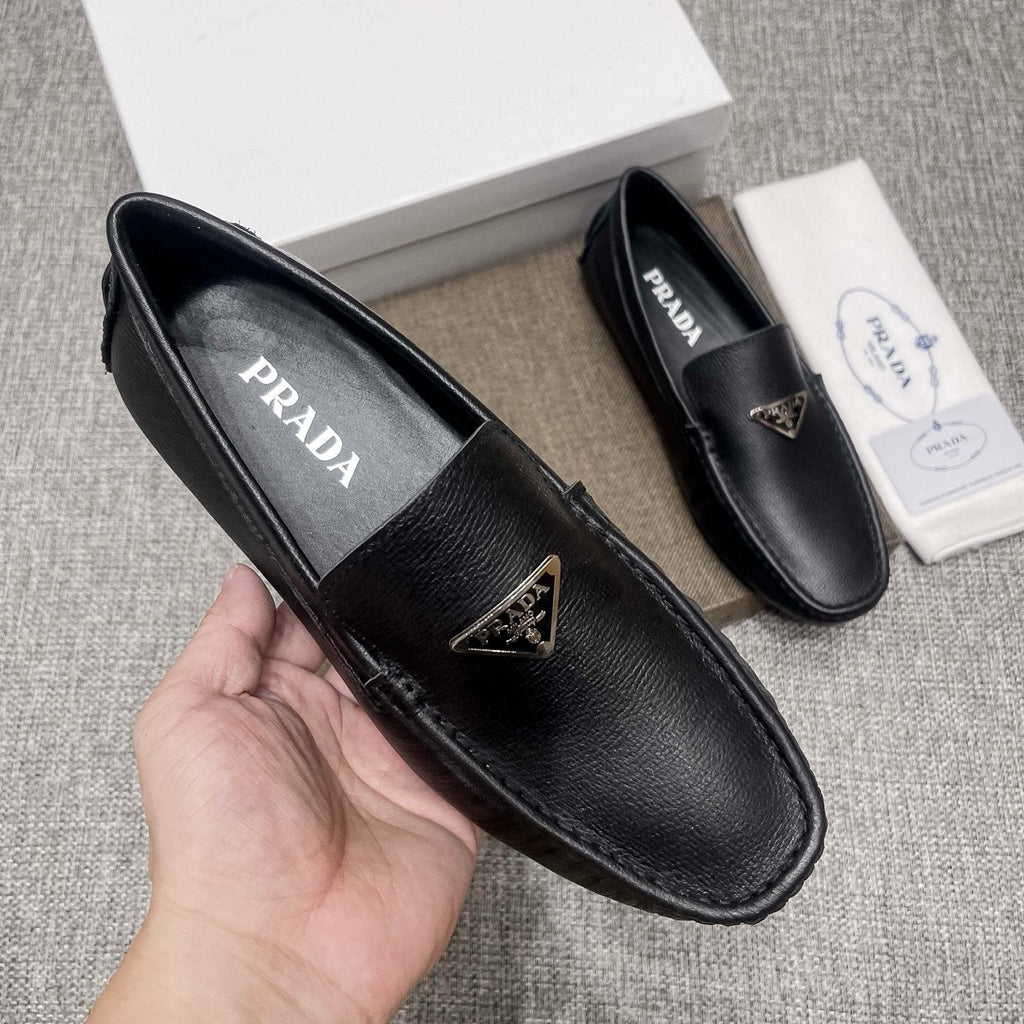 Prada Black Triangle Plaque Loafers — model