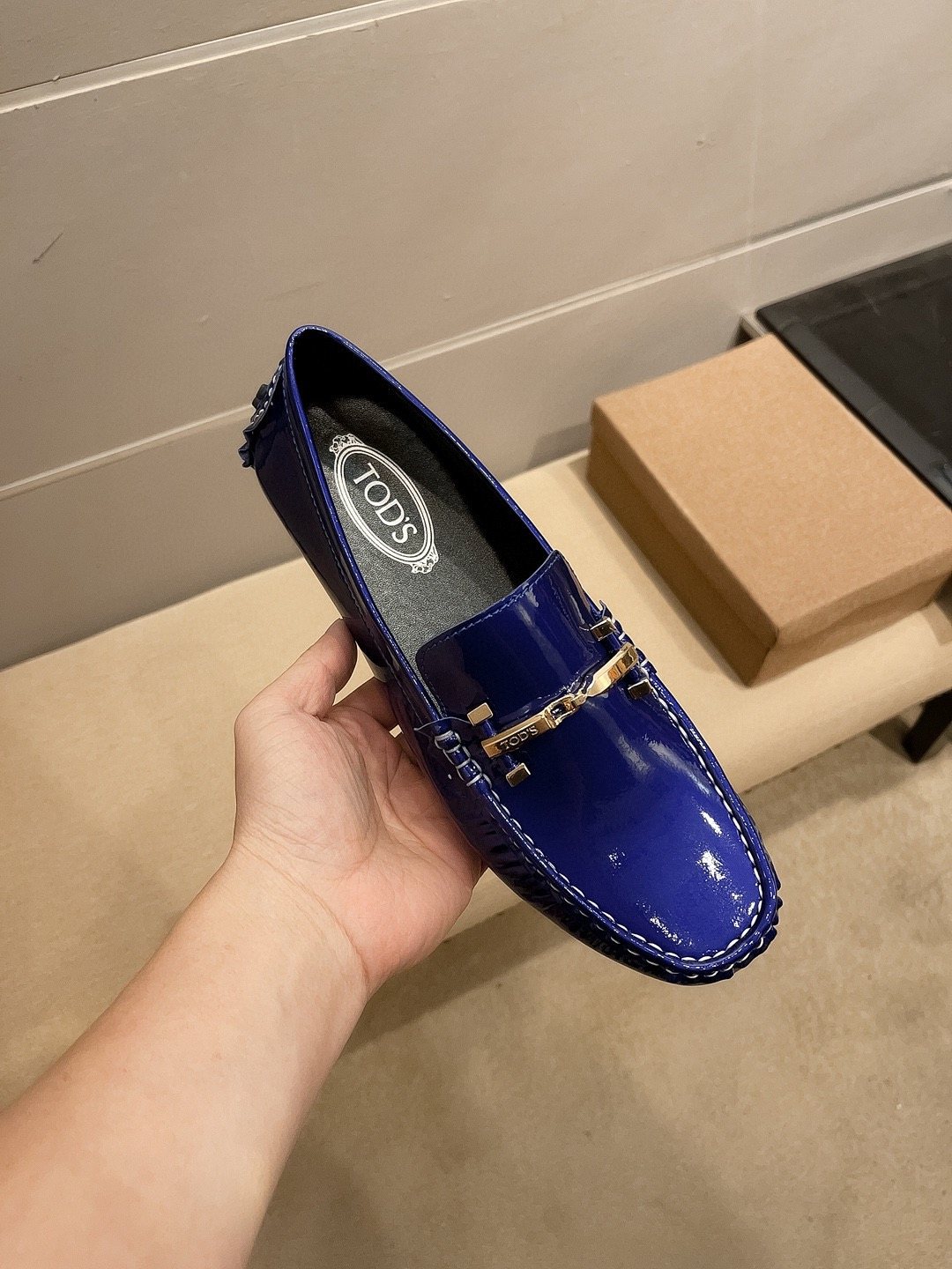 Tod's Glossy Metal Bar Loafers — model
