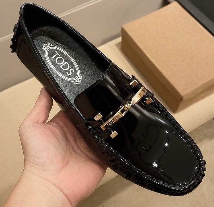 Tod's Glossy Metal Bar Loafers — front