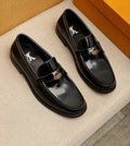 Louis Vuitton Black Leather Buckle Loafers — hero