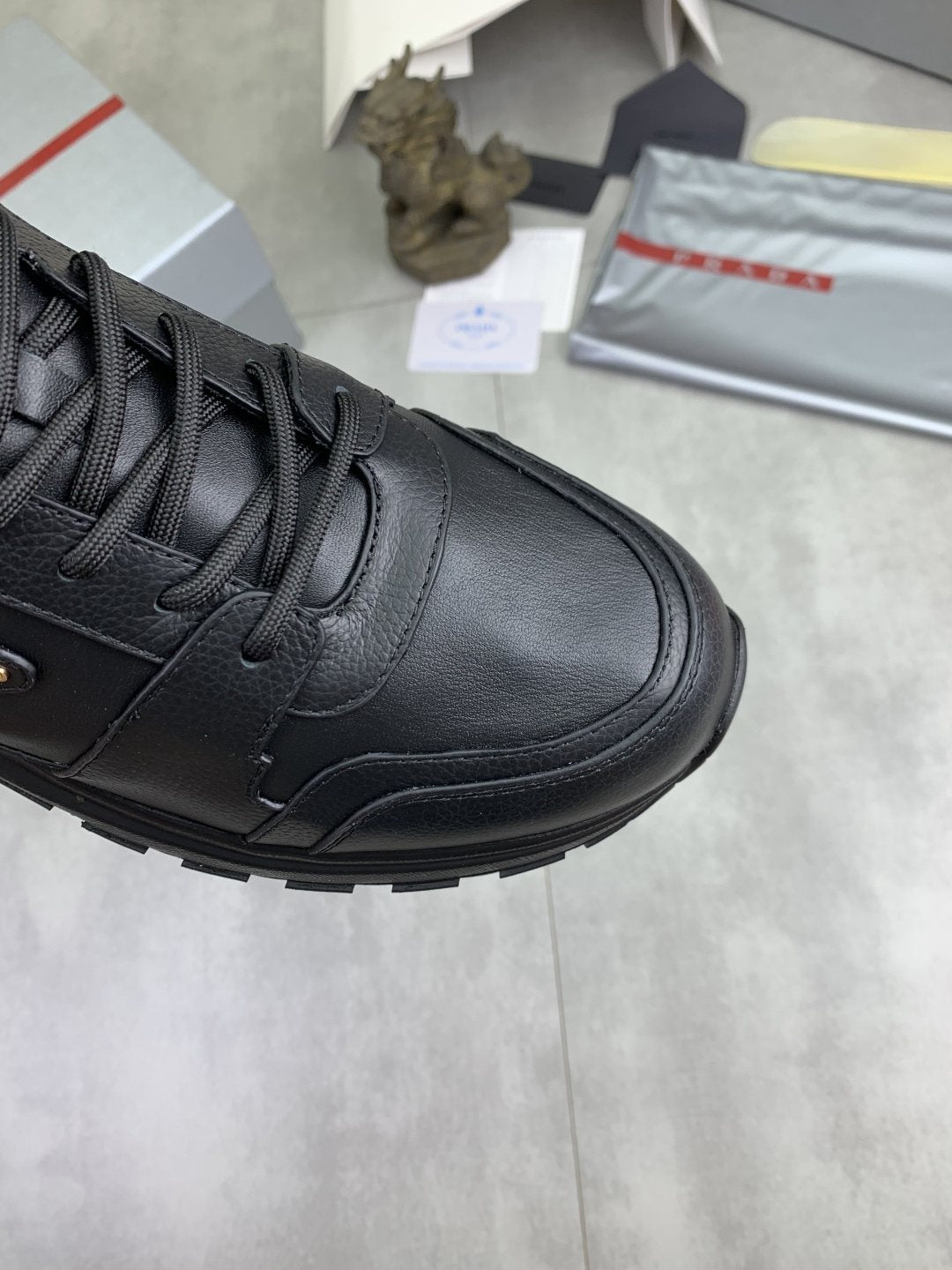 Prada Black Lug Sole Sneakers — detail