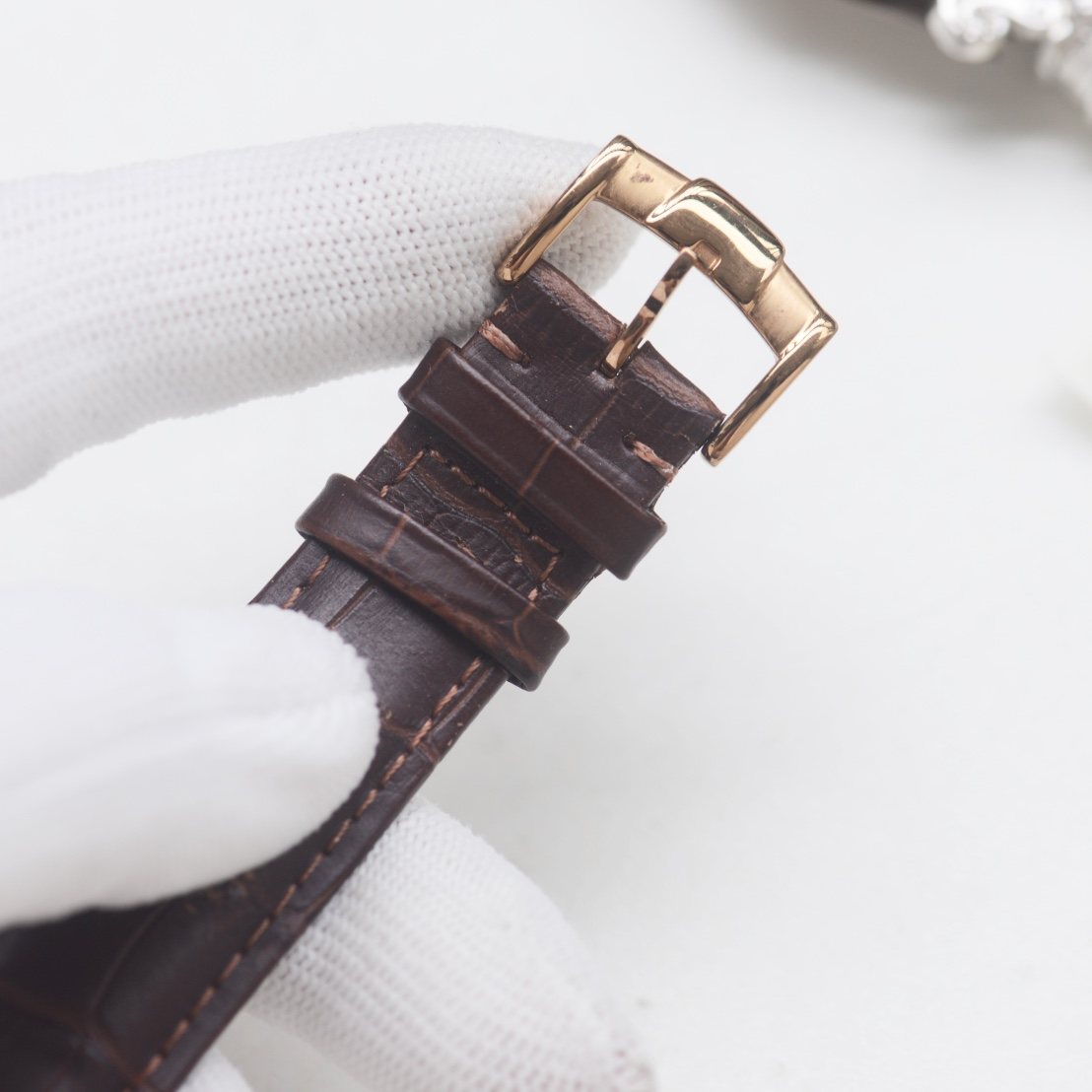 Patek Philippe Rose Gold White Strap Watch — detail