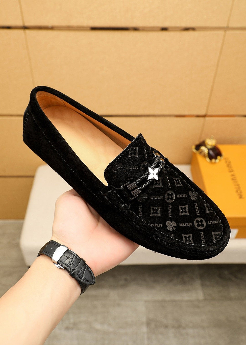 Louis Vuitton Embossed Metal-Detail Loafers — model
