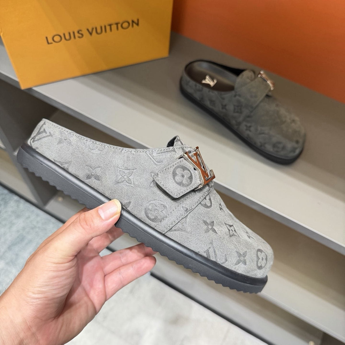 Louis Vuitton Embossed Buckle Slide Sandals — model