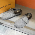 Louis Vuitton Embossed Buckle Slide Sandals — front
