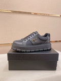 Prada Triangle Plaque Low-Top Sneakers — front