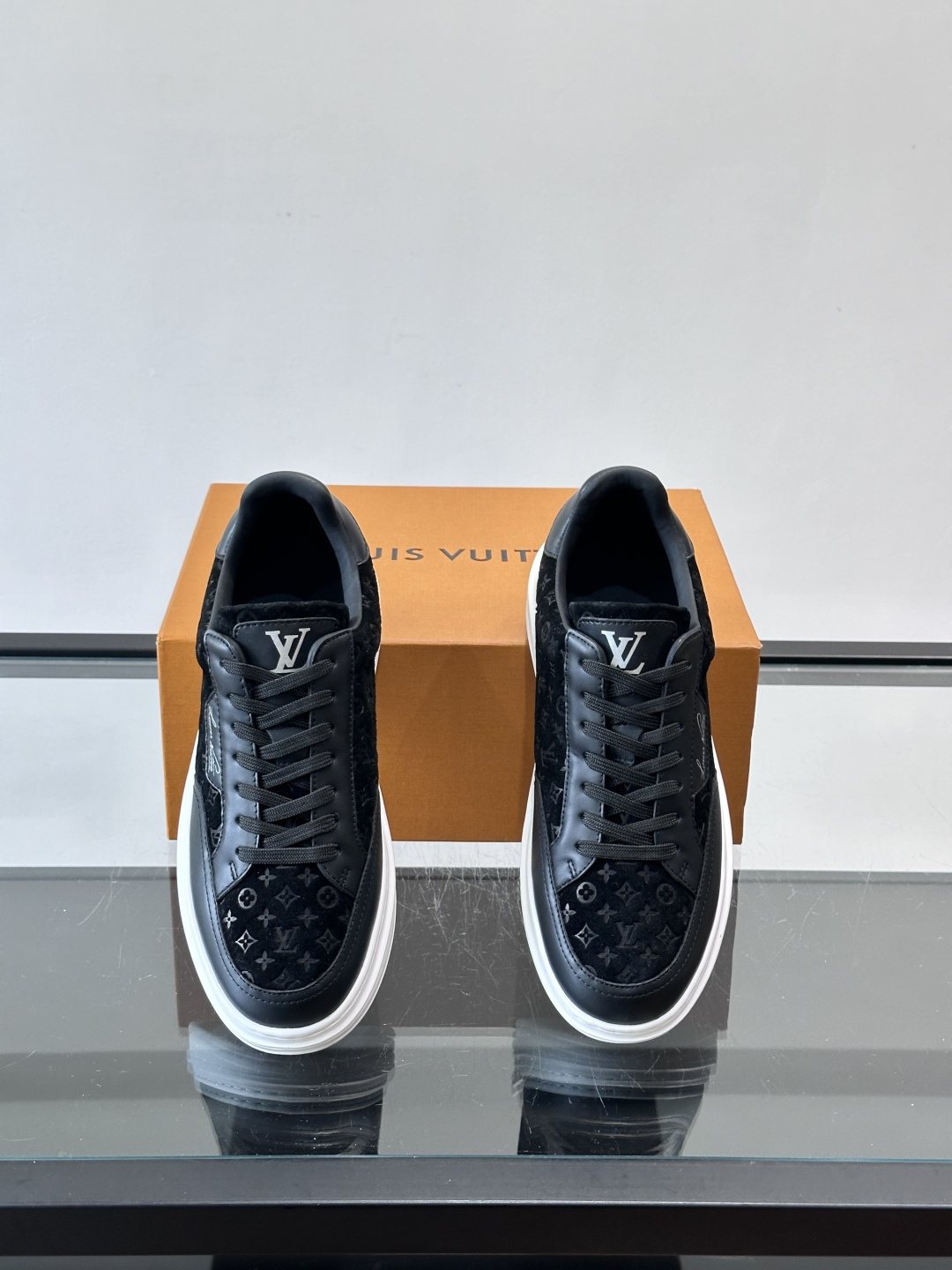 Louis Vuitton Embossed Low-Top Sneakers — front