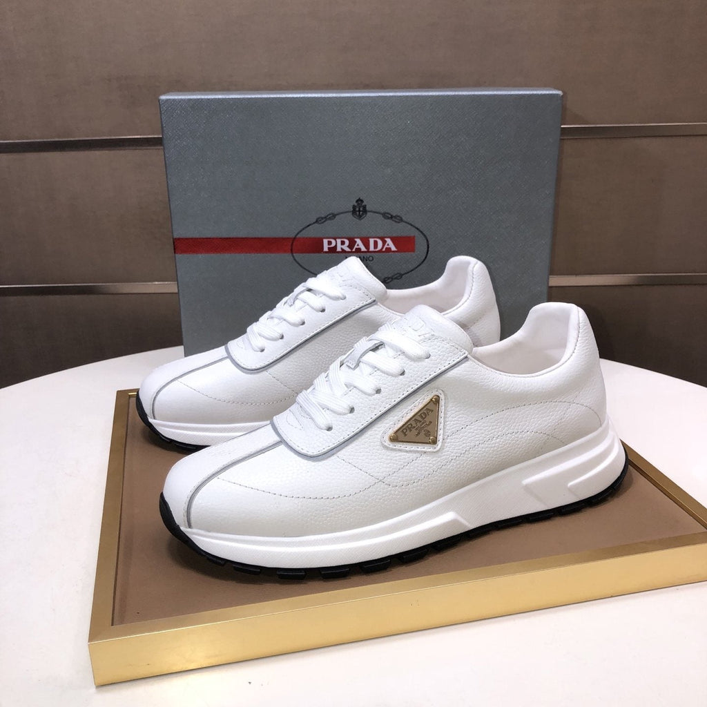 Prada Triangle Plaque Low-Top Sneakers — front