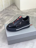 Prada Triangle Patch Low-Top Sneakers — hero