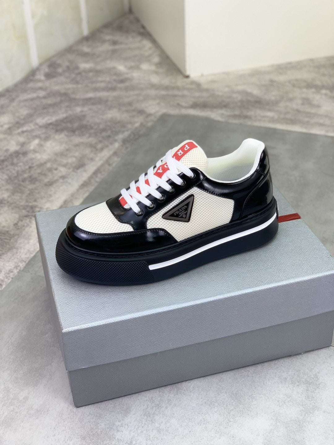 Prada Triangle Patch Low-Top Sneakers — side