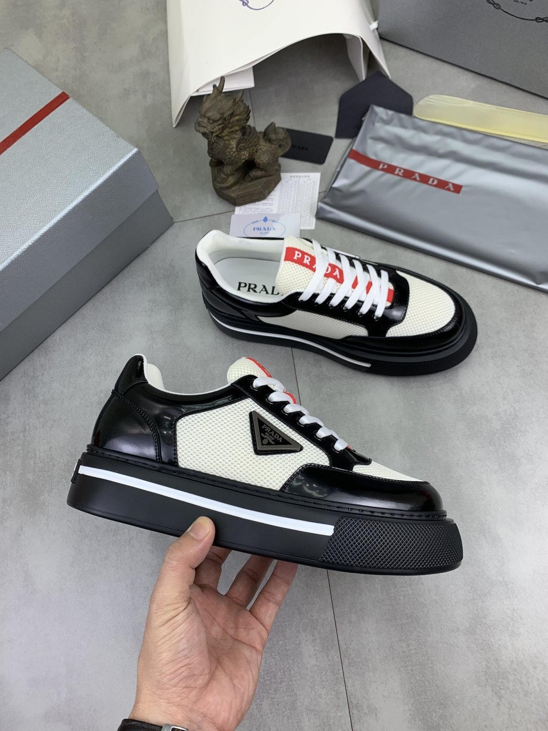 Prada Triangle Patch Low-Top Sneakers — side