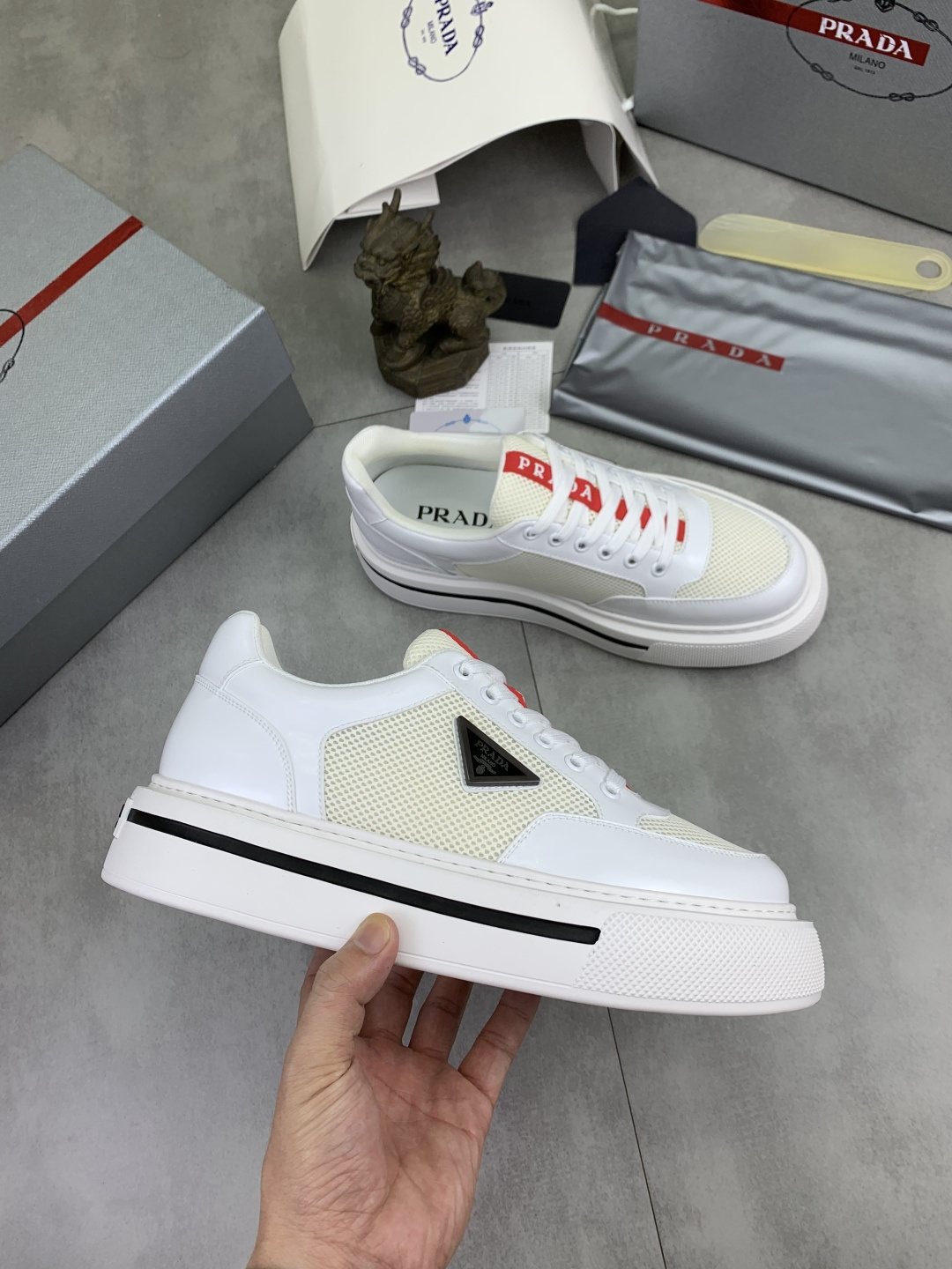 Prada Triangle Patch Low-Top Sneakers — side