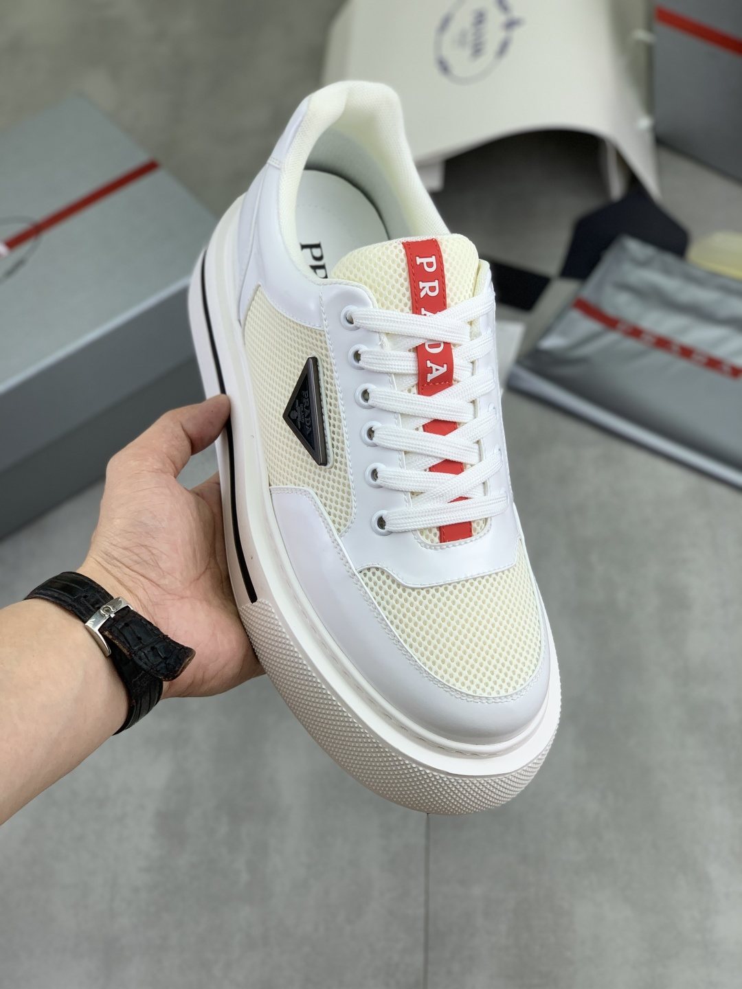 Prada Triangle Patch Low-Top Sneakers — front