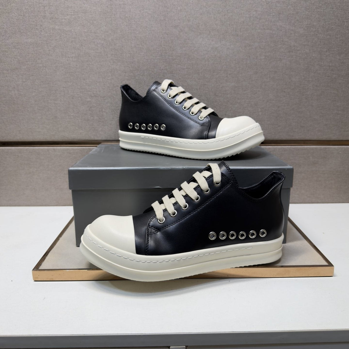 Black and Off-White Low-Top Sneakers — front