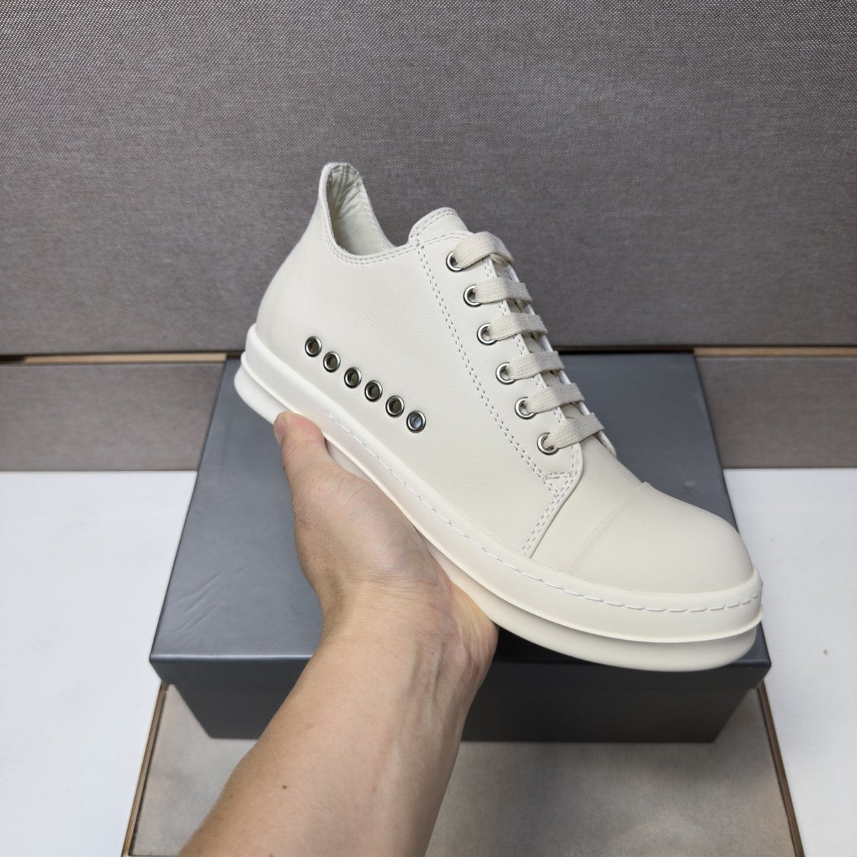 Black and Off-White Low-Top Sneakers — model