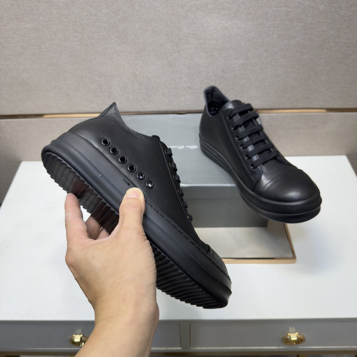 Black and Off-White Low-Top Sneakers — model