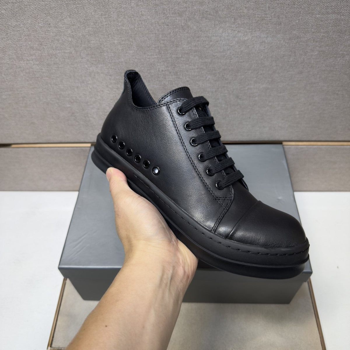 Black and Off-White Low-Top Sneakers — model
