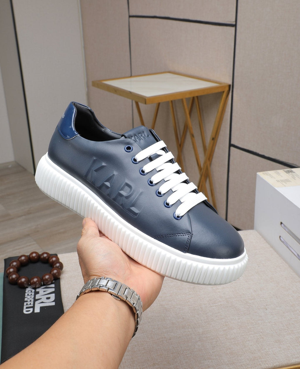 Karl Lagerfeld Embossed Logo Low-Top Sneakers — model