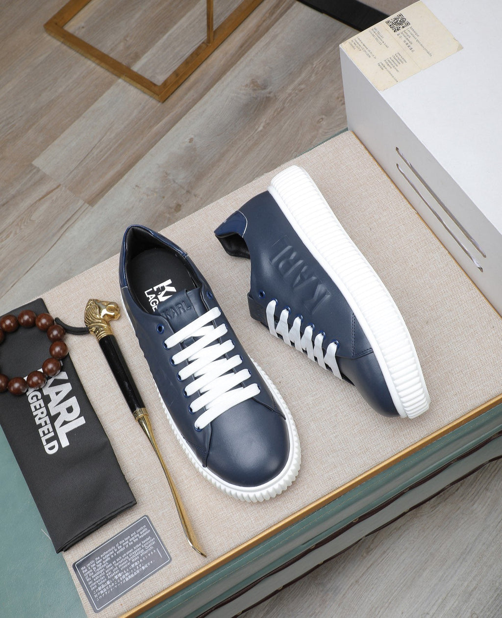 Karl Lagerfeld Embossed Logo Low-Top Sneakers — front