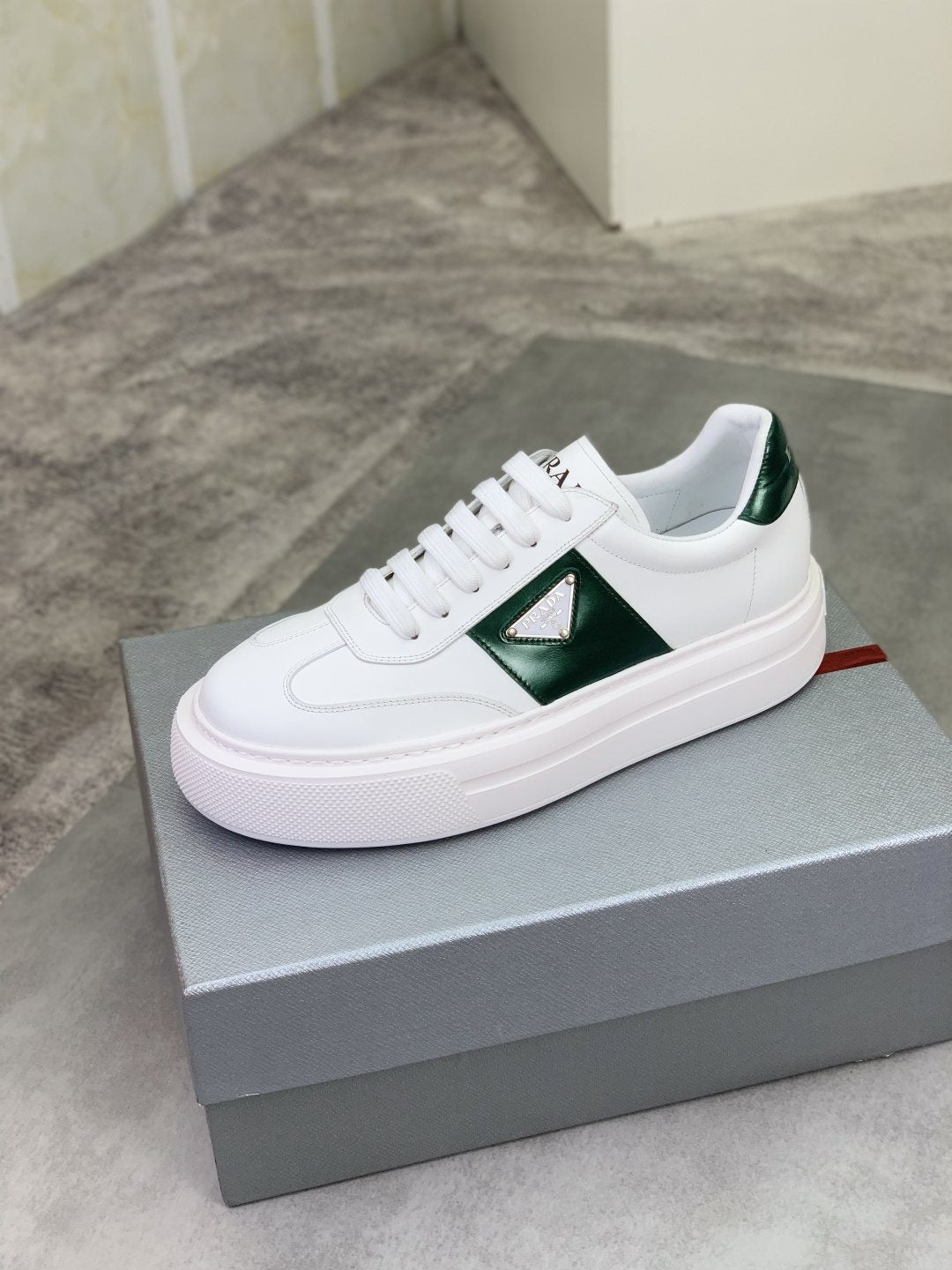Prada Triangle Panel Low-Top Sneakers — hero
